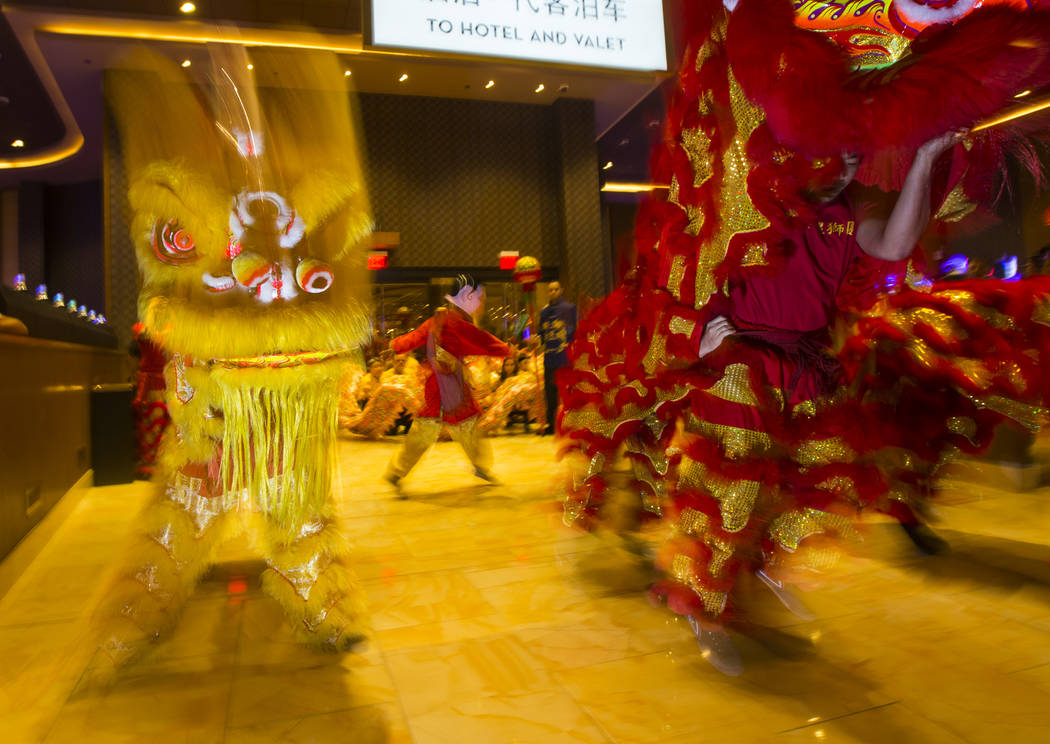 Members of the Lohan School of Shaolin entertain the crowd with a traditional lion and dragon dance during the 1-year anniversary of the Lucky Dragon in Las Vegas on Sunday, Dec. 3, 2017. Chase St ...
