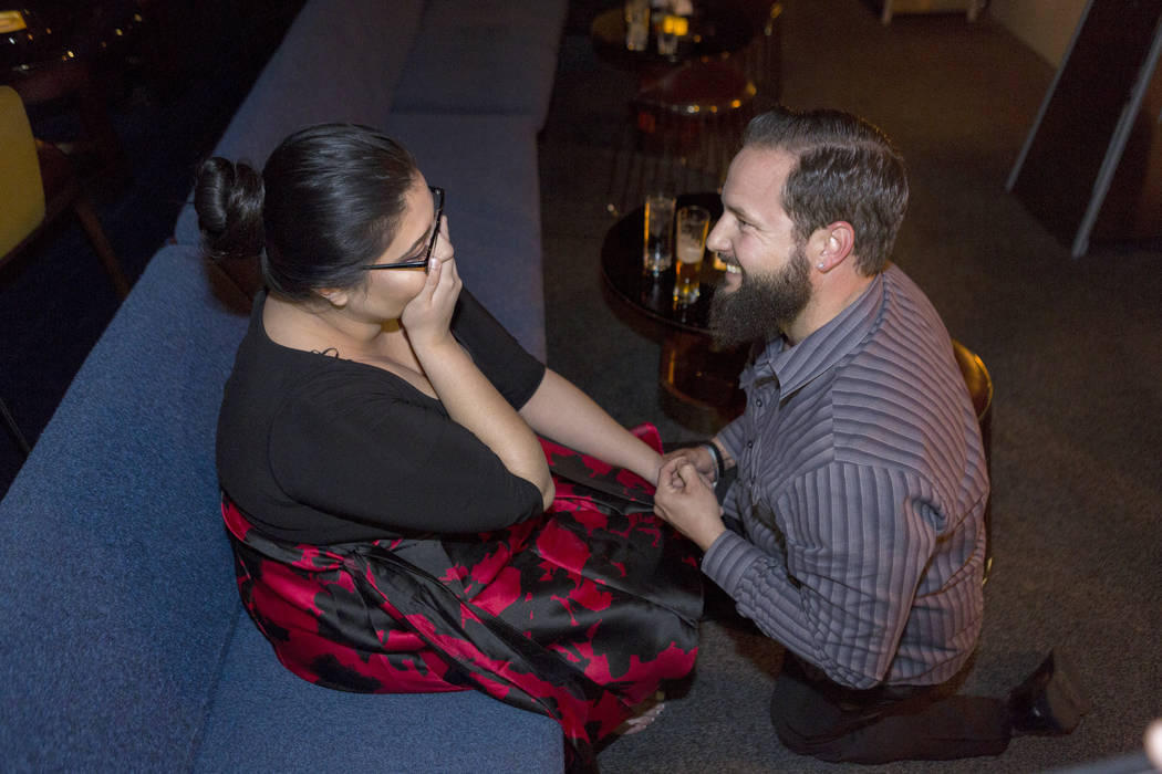 Kimberly Calderon, left, is in shock while William King proposes at the Delano Las Vegas hotel-casino in Las Vegas. Saturday, Dec. 9, 2017. Elizabeth Brumley Las Vegas Review-Journal  @EliPagePhoto