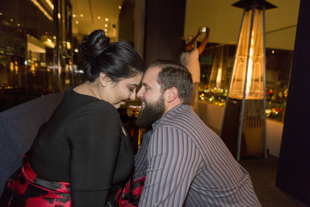 Kimberly Calderon, left, and William King, celebrate after King proposed and she accepted at the Delano Las Vegas hotel-casino in Las Vegas. Saturday, Dec. 9, 2017. Elizabeth Brumley Las Vegas Rev ...