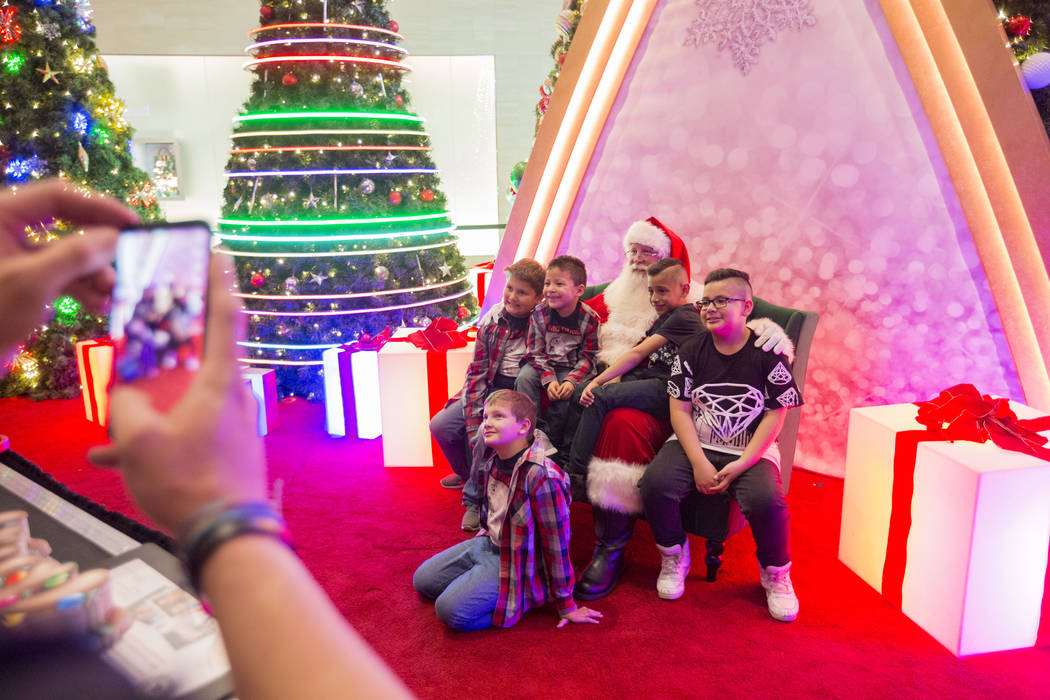 The King family and their cousins take a photo with Santa as a family tradition, at the Fashion Show Mall, Wednesday, Dec. 6, 2017 in Las Vegas. Elizabeth Brumley Las Vegas Review-Journal  @EliPag ...