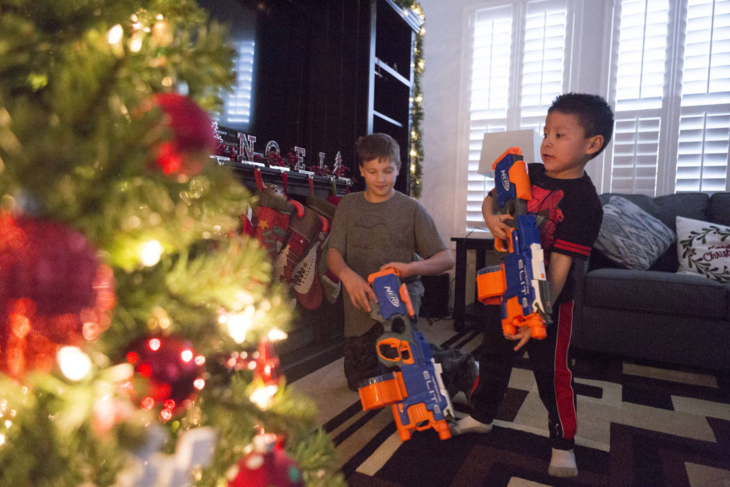 Enoch king, 9, and Maximus Calderon, 6, play with their toys given to them by Central Church, Wednesday, Dec. 6, 2017 in Las Vegas. Elizabeth Brumley Las Vegas Review-Journal  @EliPagePhoto