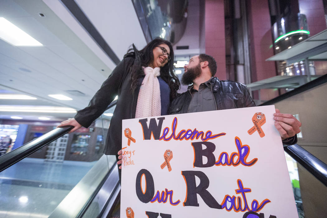 William King, left, Kimberly Calderon anxiously wait to meet their heroes at the Saturday, Dec. 9, 2017, at McCarran International Airport in Las Vegas. Jospeh and Paol Nolan helped bring King and ...
