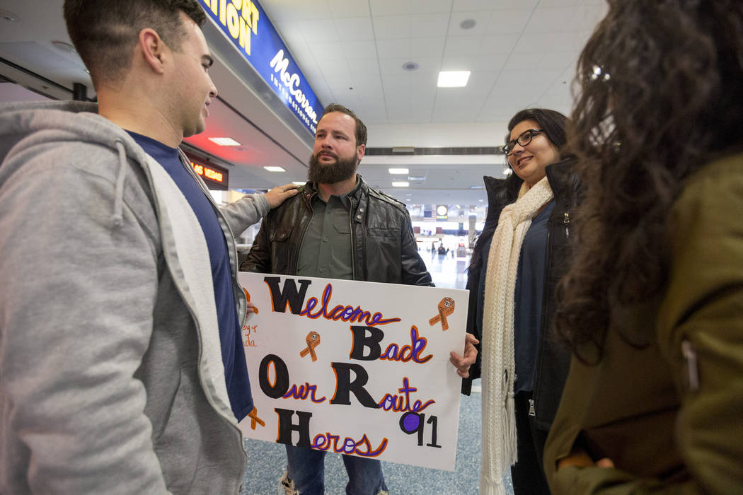 Joseph Nolan, from left, William King, Kimberly Calderon and Paol Nolan meet at Saturday, Dec. 9, 2017, at McCarran International Airport in Las Vegas. It was the first time the couples has met si ...