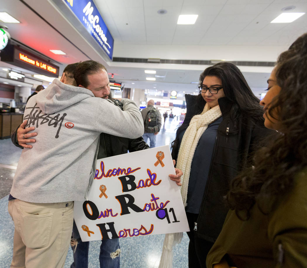 Joseph Nolan, from left, William King, Kimberly Calderon and Paol Nolan meet Saturday, Dec. 9, 2017, at McCarran International Airport in Las Vegas. It was the first time the couples has met since ...