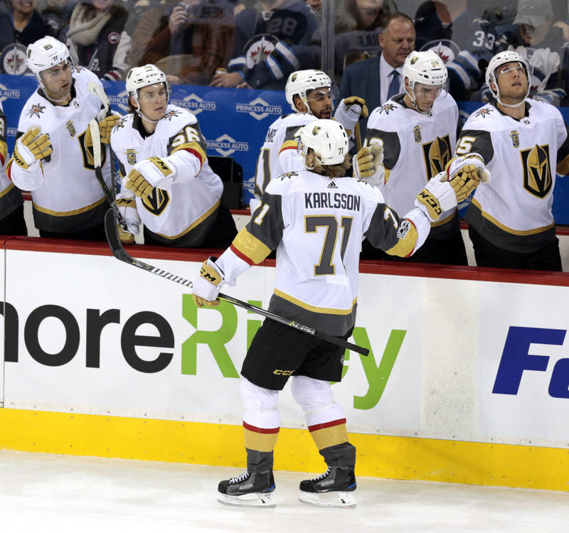 Dec 1, 2017; Winnipeg, Manitoba, CAN; Vegas Golden Knights teammates celebrate the first period goal byVegas Golden Knights center William Karlsson (71) at Bell MTS Place. Mandatory Credit: James ...