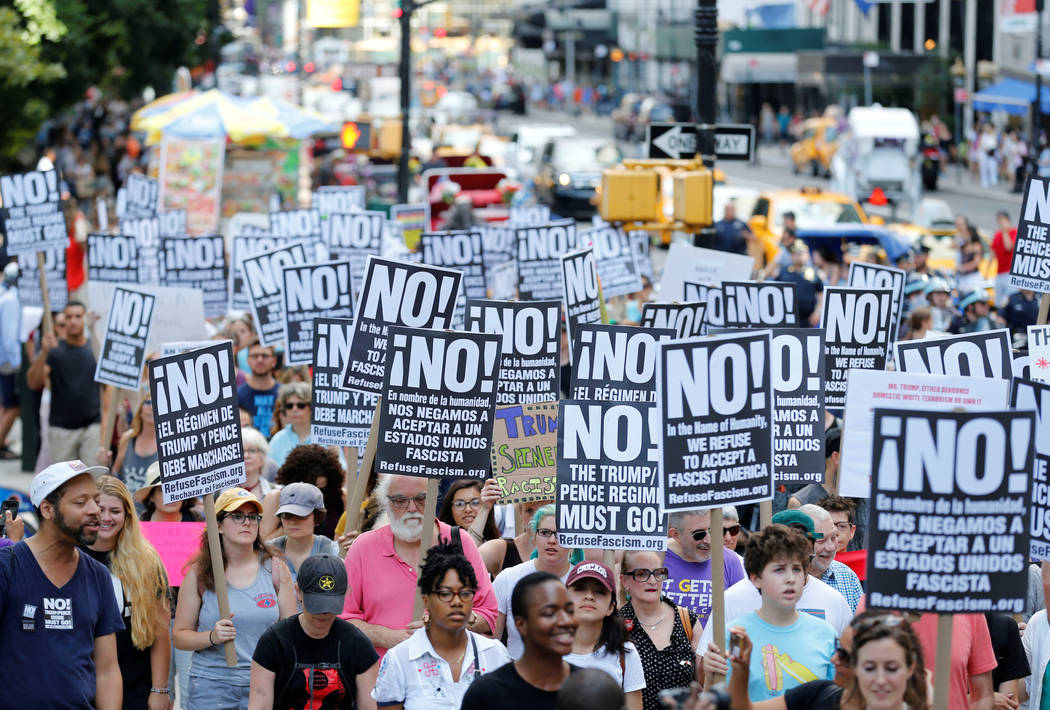 Protesters march against white nationalism in New York City, the day after the attack on counter-protesters at the &quot;Unite the Right&quot; rally organized by white nationalists in Char ...