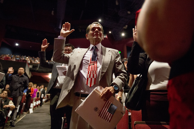 New United States citizens recite the Oath of Allegiance while participating in a naturalization ceremony at Cashman Field Thursday, Sept. 22, 2016, in Las Vegas. (Elizabeth Page Brumley/Las Vegas ...