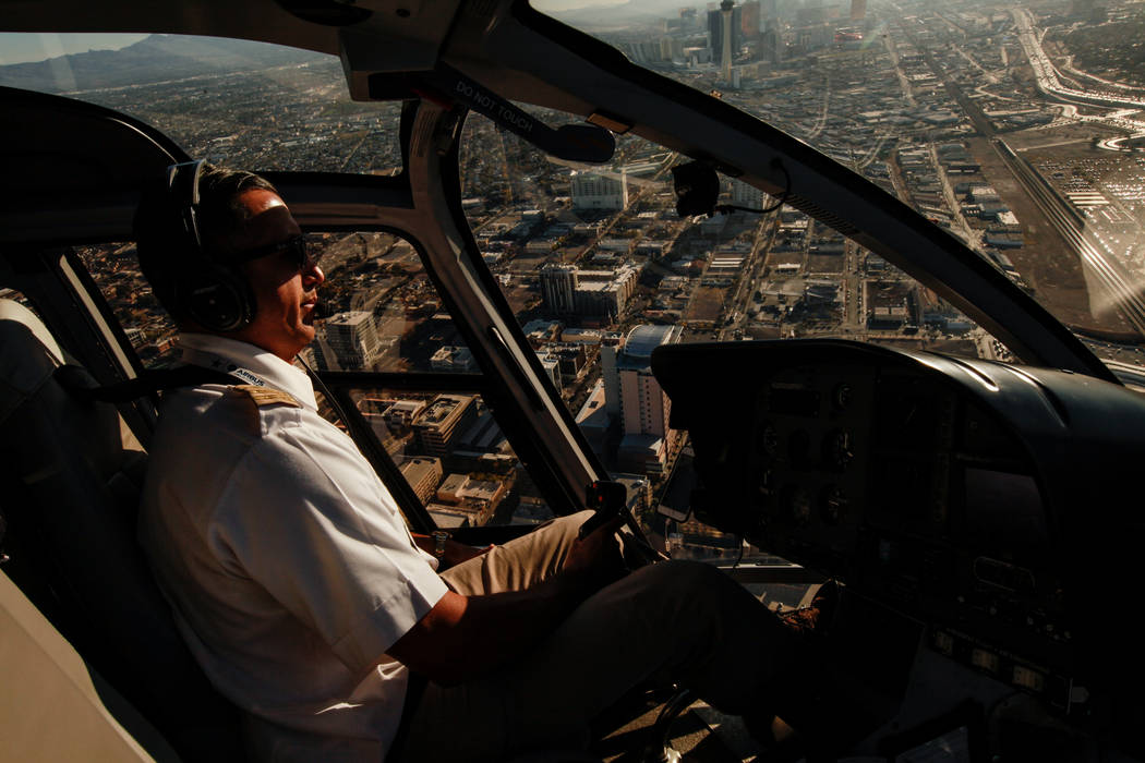 Maverick Helicopters Pilot Joe Munoz, 41, flies above Las Vegas, Friday, Dec. 1, 2017. Joel Angel Juarez Las Vegas Review-Journal @jajuarezphoto