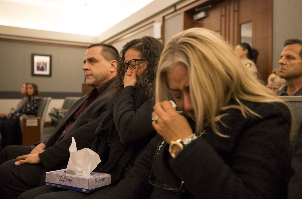 Ken Seal, from left, his wife Gaudia Martinez-Seal and their cousin Gema Cripen, family members ...