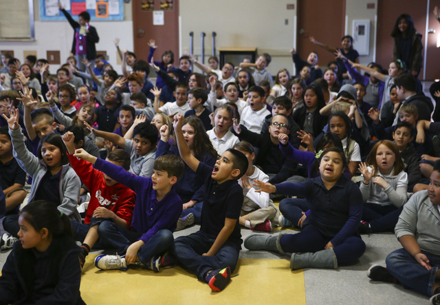 Students raise their hands as Retired NASA astronaut Don Thomas talks about his experience working and living in space at Gordon McCaw Elementary School in Henderson on Wednesday, Jan. 4, 2017. Th ...