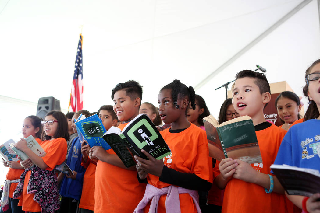 Students from Walter Bracken Elementary sing a song regarding learning from books during the Las Vegas-Clark County Library District ground breaking of the new East Las Vegas Library branch in Las ...