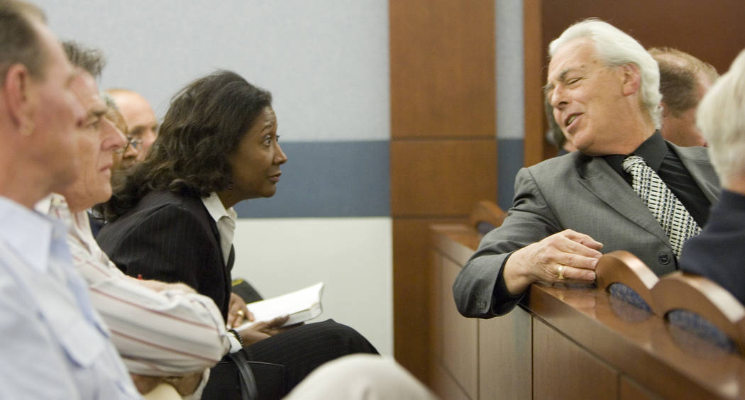 Former county commissioner Lynette Boggs leans forward to listen to her attorney Bill Terry, right, in Las Vegas Justice Court, Thursday morning, June 7, 2007. Bogss appeared in court to face felo ...