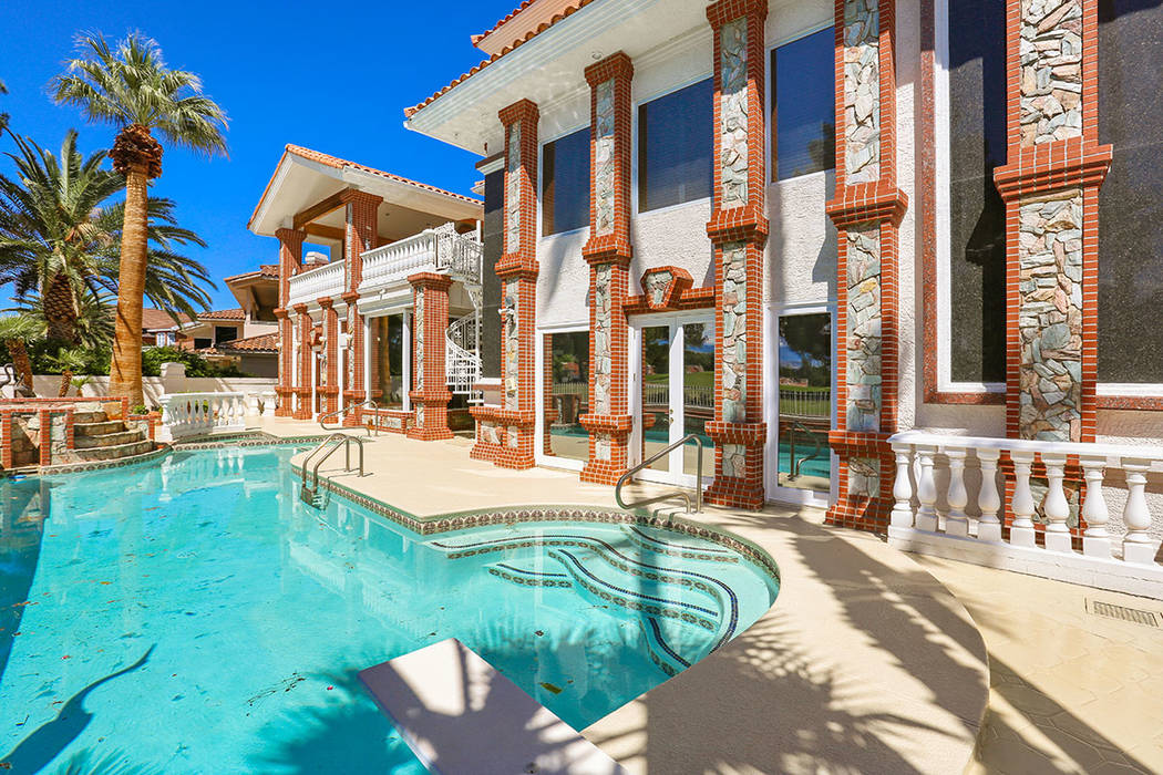 The home has a pool in the backyard. (Luxury Estates International)