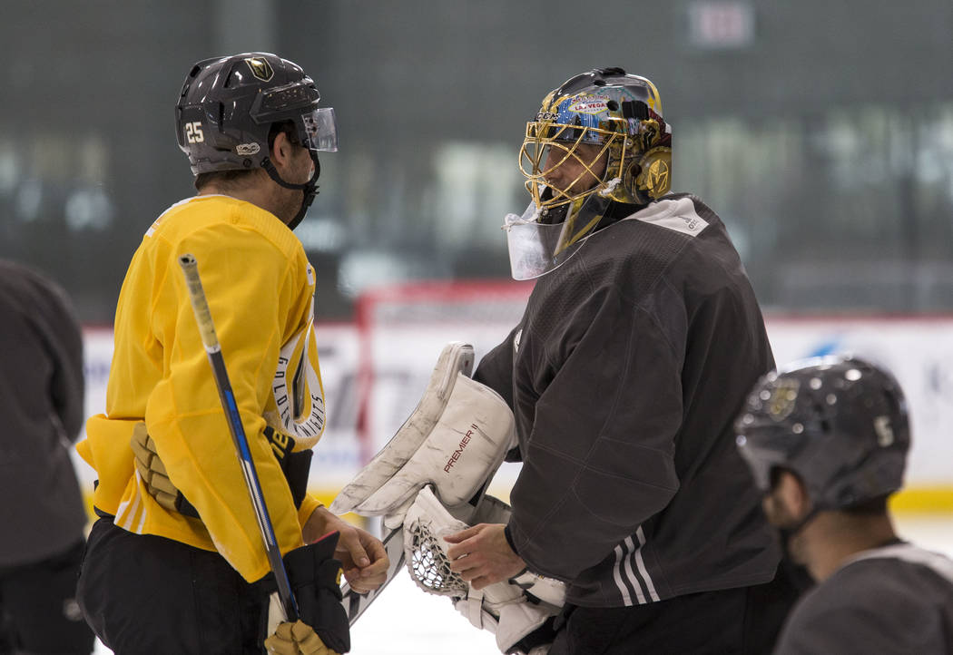 Vegas Golden Knights center Stefan Matteau (25) talks with goalie Marc-Andre Fleury during the NHL team's practice at the City National Arena in Las Vegas, Wednesday, Dec. 6, 2017. Richard Brian L ...