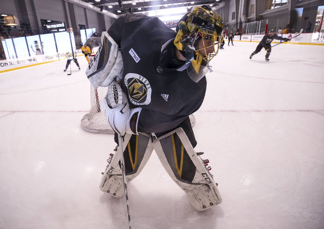 Vegas Golden Knights goalie Marc-Andre Fleury (29) controls the puck behind the net in a drill during the NHL team's practice at the City National Arena in Las Vegas, Wednesday, Dec. 6, 2017. Rich ...