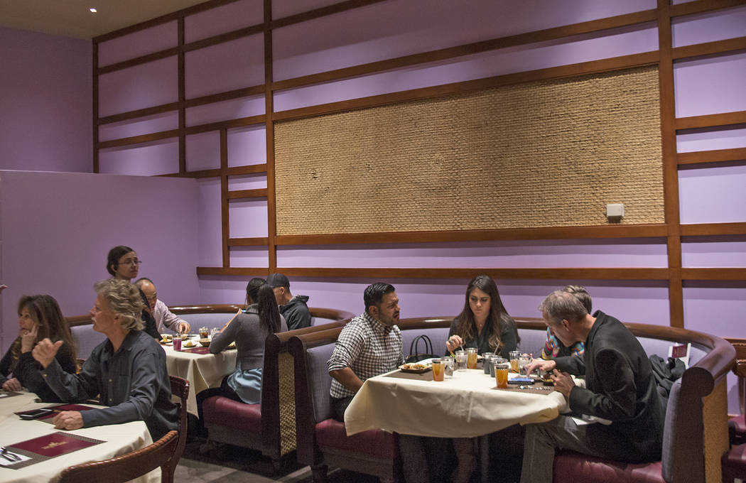 Guests eat in the dinning room at the new second location of Lotus of Siam, a thai restaurant, in Las Vegas, Sunday, Dec. 10, 2017. The restaurant held a birthday party for Chef Saipin Chutima tha ...