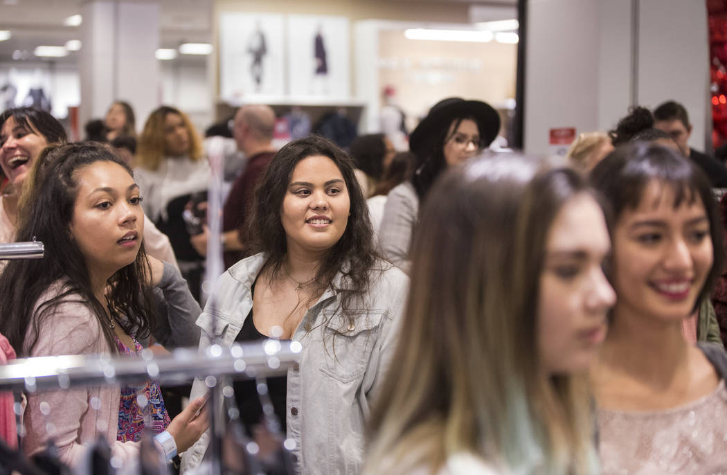 Attendees wait to meet model and designer Ashley Graham during an event to celebrate the release of Graham's holiday collection of lingerie at Macy's Fashion Show on Wednesday, Nov. 29, 2017, in L ...