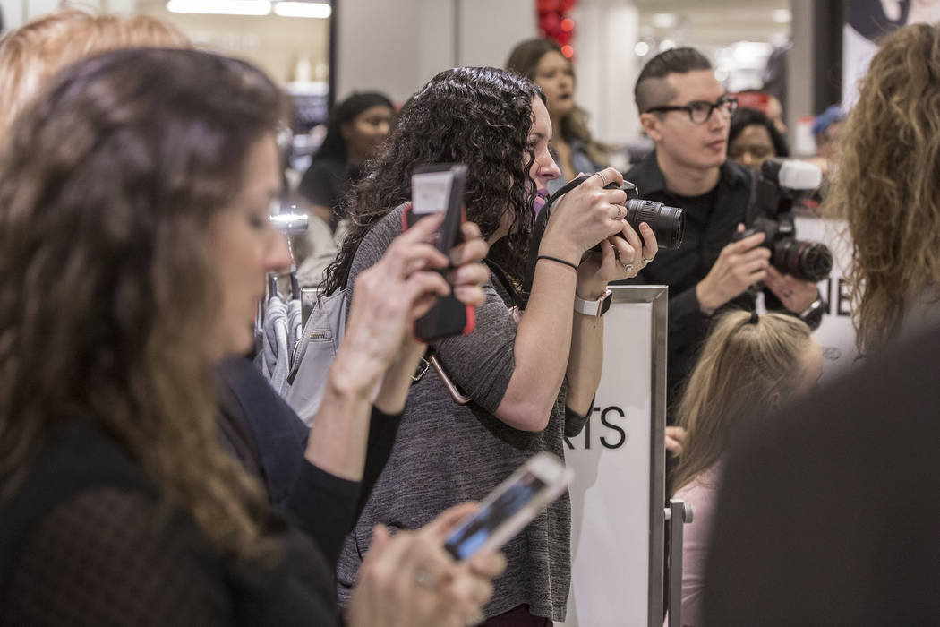 Attendees wait to meet model and designer Ashley Graham during an event to celebrate the release of Graham's holiday collection of lingerie at Macy's Fashion Show on Wednesday, Nov. 29, 2017, in L ...