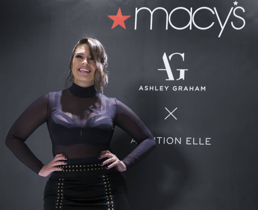 Model and designer Ashley Graham takes photos  during a meet and greet to celebrate the release of Graham's holiday collection of lingerie at Macy's Fashion Show on Wednesday, Nov. 29, 2017, in La ...