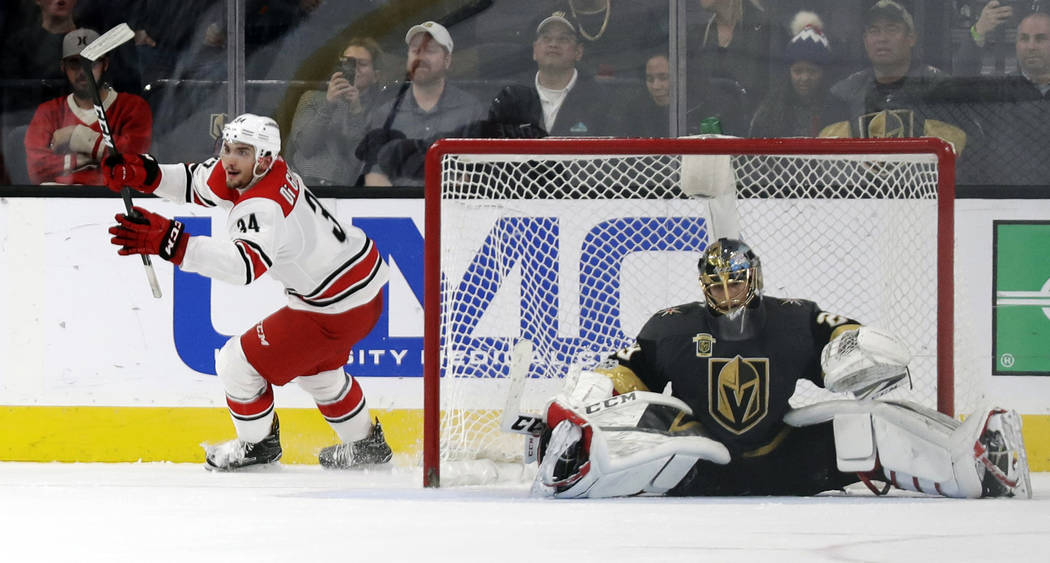 Carolina Hurricanes left wing Phil Di Giuseppe reacts after scoring on Vegas Golden Knights goalie Marc-Andre Fleury during a shootout to win an NHL hockey game 3-2 Tuesday, Dec. 12, 2017, in Las  ...
