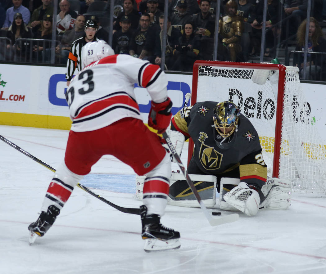 Vegas Golden Knights goalie Marc-Andre Fleury (29) makes a save after Carolina Hurricanes left wing Jeff Skinner (53) shoots during the first period of a NHL game in Las Vegas, Tuesday, Dec. 12, 2 ...