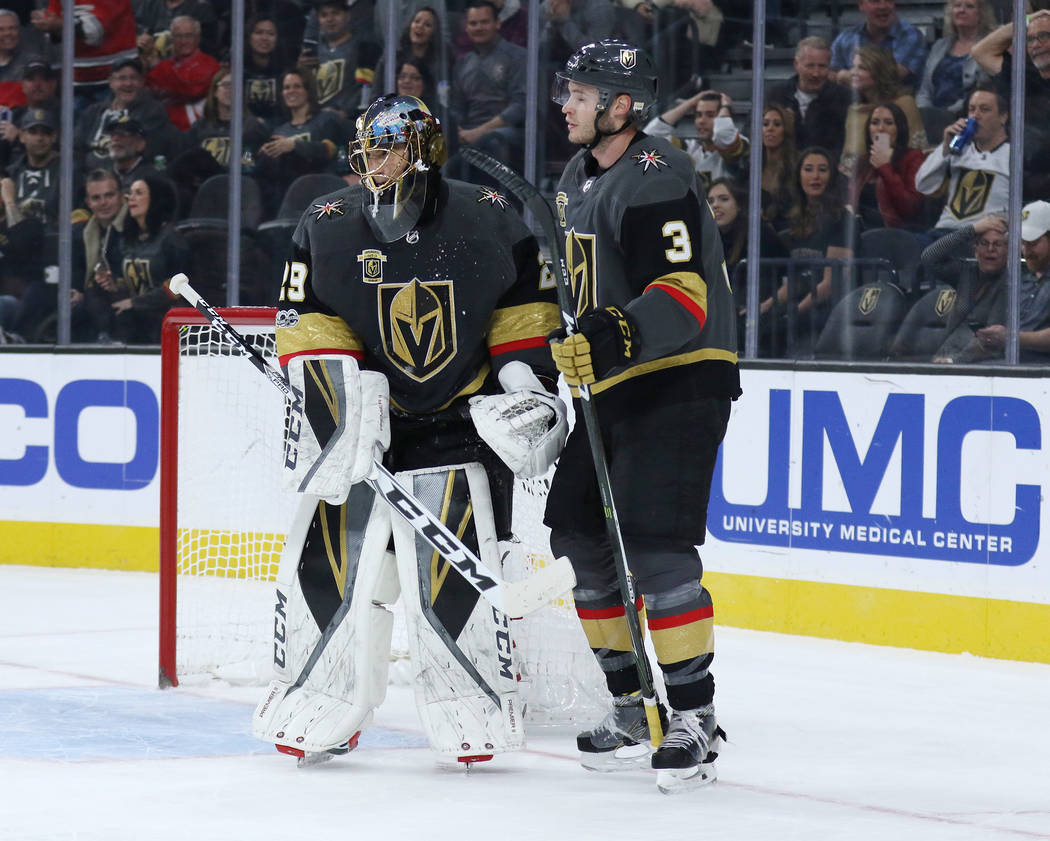 Vegas Golden Knights goalie Marc-Andre Fleury (29) and defenseman Brayden McNabb (3) talk on the ice after a goal is scored by the Carolina Hurricanes during the first period of a NHL game in Las  ...