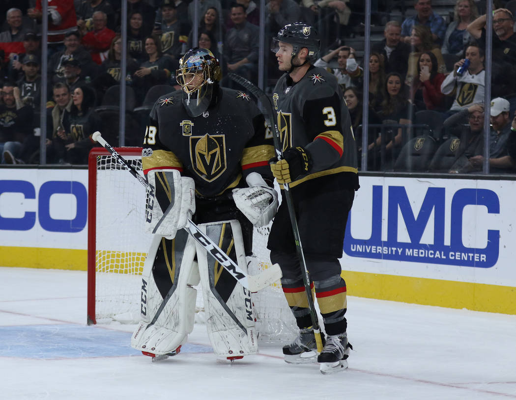Vegas Golden Knights goalie Marc-Andre Fleury (29) and defenseman Brayden McNabb (3) talk on the ice after a goal is scored by the Carolina Hurricanes during the first period of a NHL game in Las ...