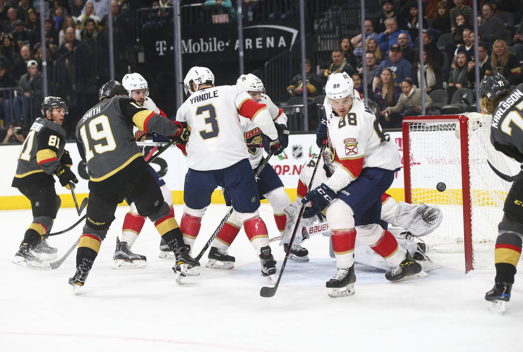 The puck flies by the goal as Golden Knights players attempt to score on the Florida Panthers during an NHL hockey game at T-Mobile Arena in Las Vegas on Sunday, Dec. 17, 2017. Chase Stevens Las V ...