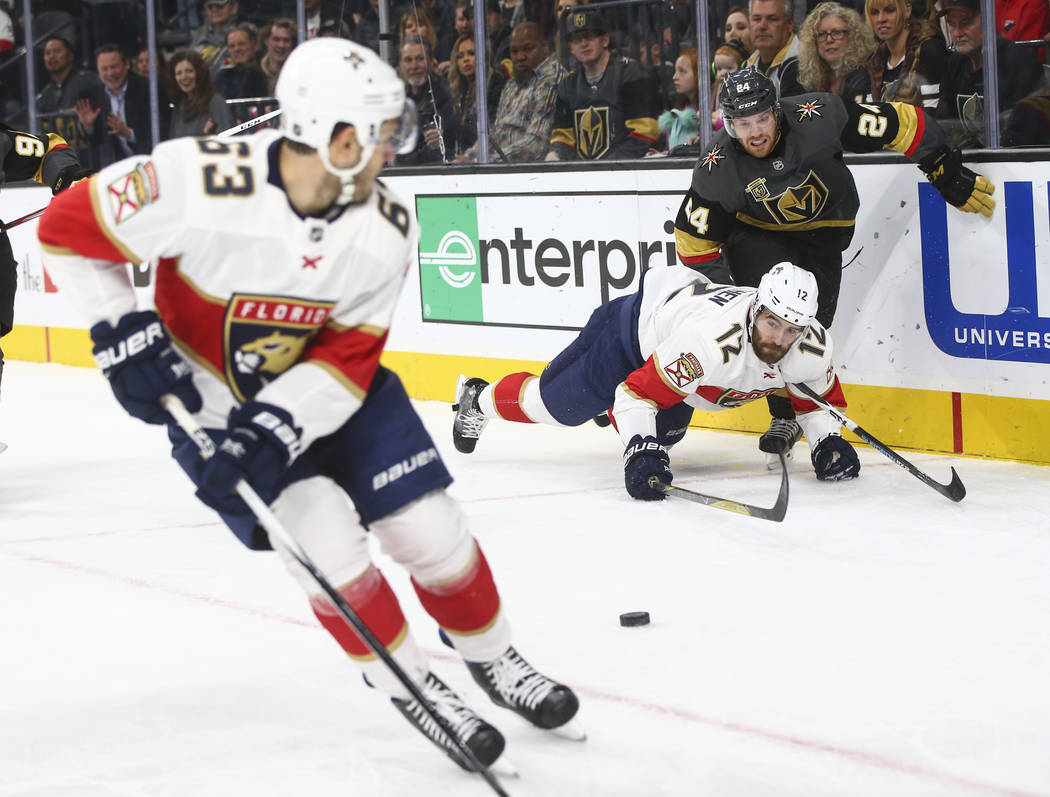 Florida Panthers' Ian McCoshen (12) gets tripped up by Golden Knights' Oscar Lindberg (24) during an NHL hockey game at T-Mobile Arena in Las Vegas on Sunday, Dec. 17, 2017. Chase Stevens Las Vega ...
