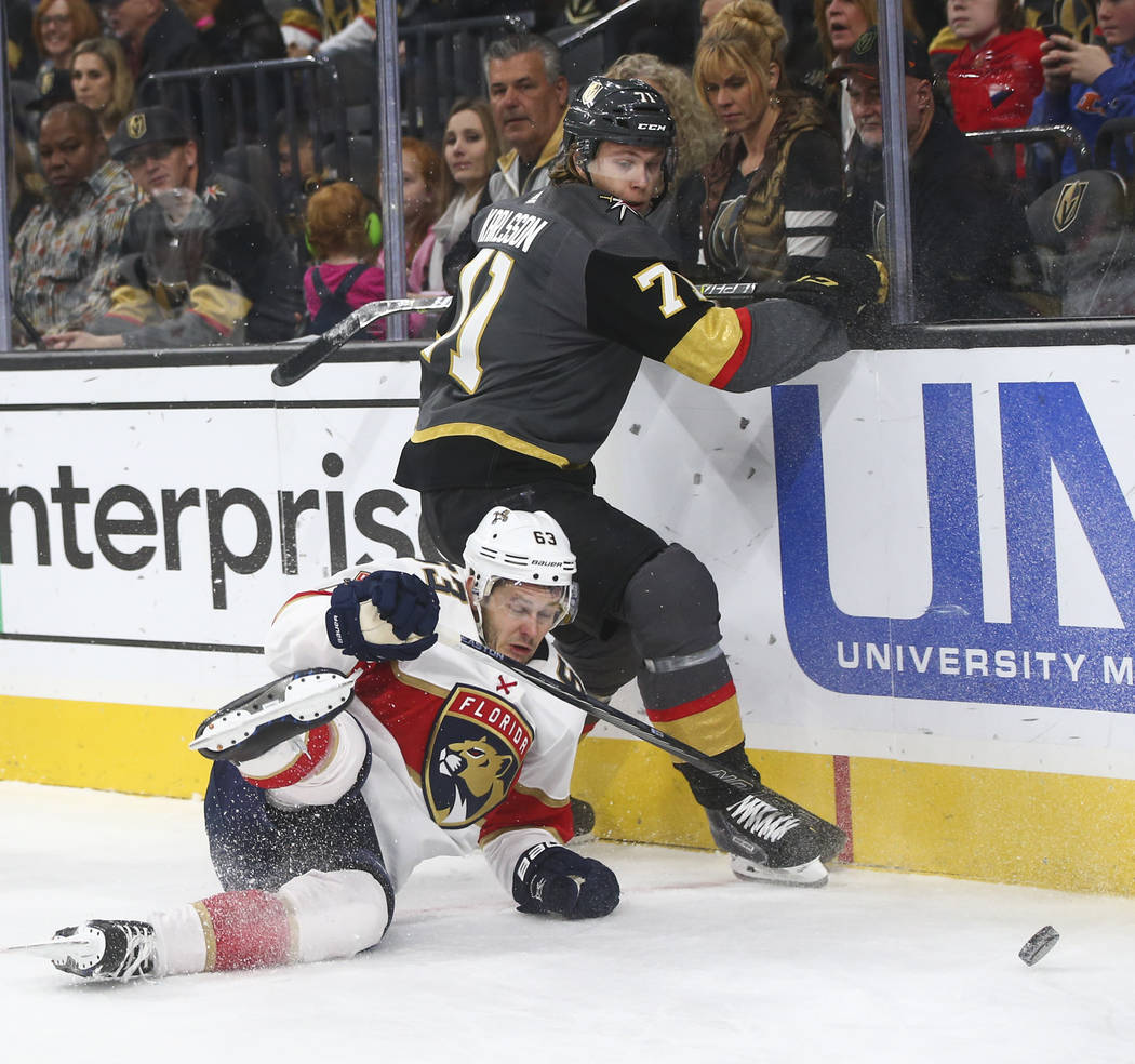 Florida Panthers' Evgenii Dadonov (63) gets tripped up by Golden Knights' William Karlsson (71) during an NHL hockey game at T-Mobile Arena in Las Vegas on Sunday, Dec. 17, 2017. Chase Stevens Las ...