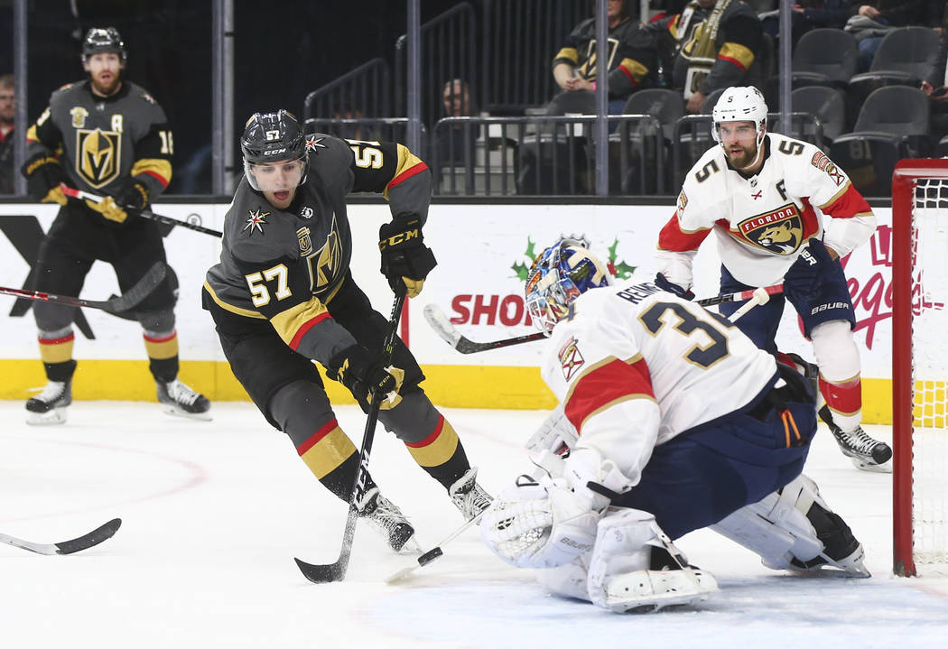 Florida Panthers' goalie James Reimer (34) defends against a shot from Golden Knights' David Perron (57) a during an NHL hockey game at T-Mobile Arena in Las Vegas on Sunday, Dec. 17, 2017. Chase  ...
