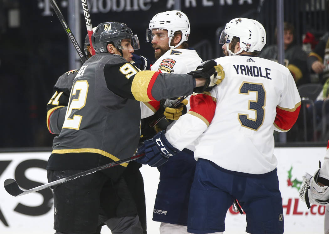 Golden Knights' Tomas Nosek (92) shoves Florida Panthers' Keith Yandle (3) during an NHL hockey game at T-Mobile Arena in Las Vegas on Sunday, Dec. 17, 2017. Chase Stevens Las Vegas Review-Journal ...
