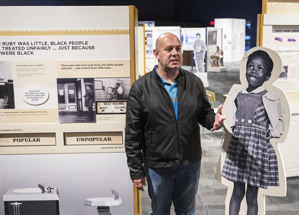 Curator Aaron Micallef gives a tour of the new Springs Preserve exhibit, &quot;The Power of Children,&quot; which focuses on the impact of Anne Frank, Ruby Bridges and Ryan White on Wed.,  ...