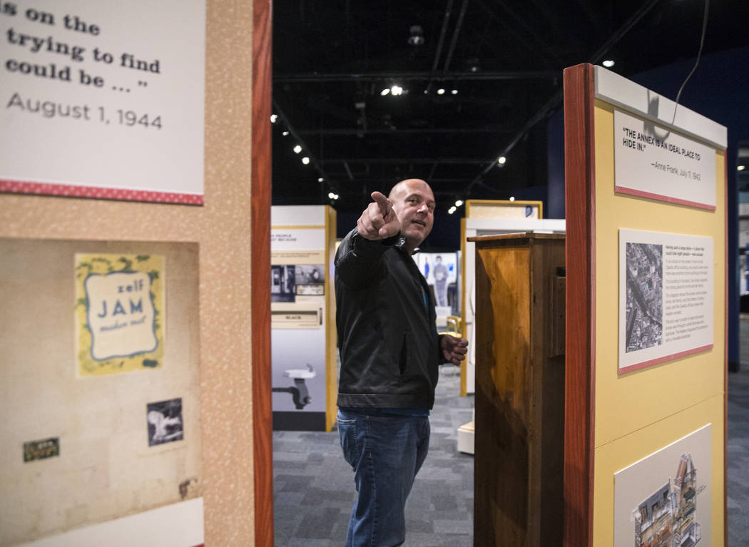 Curator Aaron Micallef gives a tour of the new Springs Preserve exhibit, &quot;The Power of Children,&quot; which focuses on the impact of Anne Frank, Ruby Bridges and Ryan White on Wed.,  ...