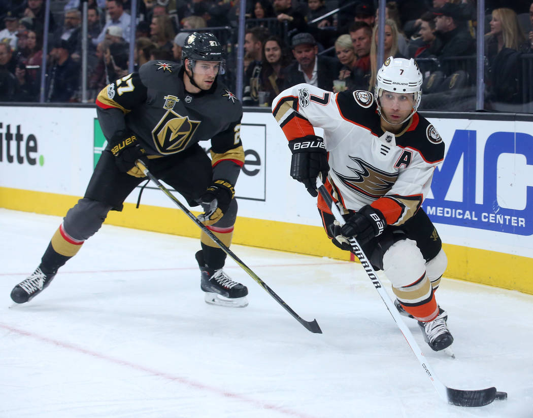 Anaheim Ducks left wing Andrew Cogliano (7) handles the puck with Vegas Golden Knights defenseman Shea Theodore (27) behind him during the second period at T-Mobile Arena in Las Vegas, Tuesday, De ...