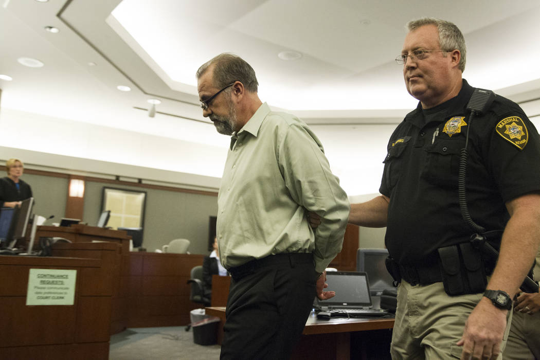 Former attorney Robert Graham, accused of swindling more than $16 million from clients, is taken into custody after his sentencing at the Regional Justice Center in Las Vegas, Friday, Dec. 8, 2017 ...