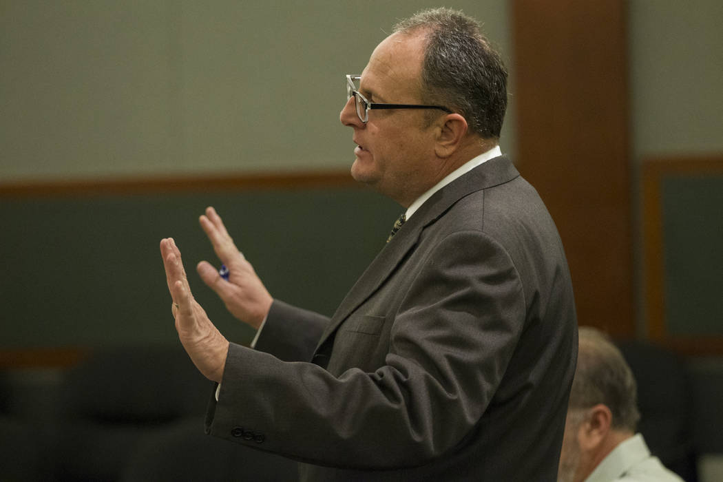 Public defender Bryan Cox during the sentencing of his client, former attorney Robert Graham, accused of swindling more than $16 million from clients, at the Regional Justice Center in Las Vegas,  ...