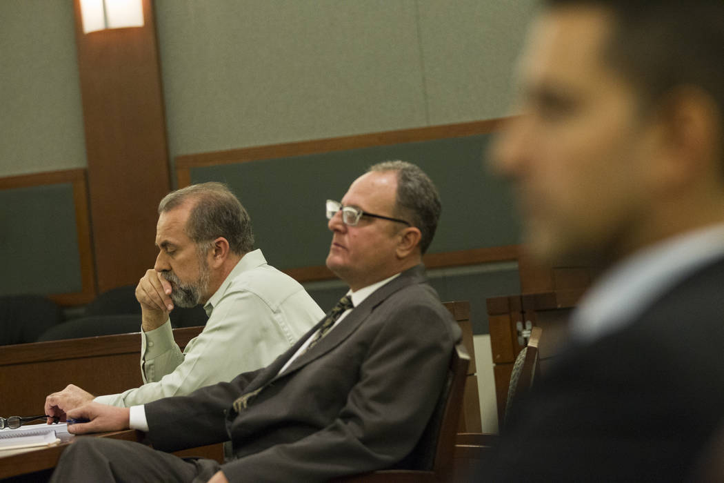 Former attorney Robert Graham, left, accused of swindling more than $16 million from clients, with his attorney Bryan Cox, during his sentencing at the Regional Justice Center in Las Vegas, Friday ...
