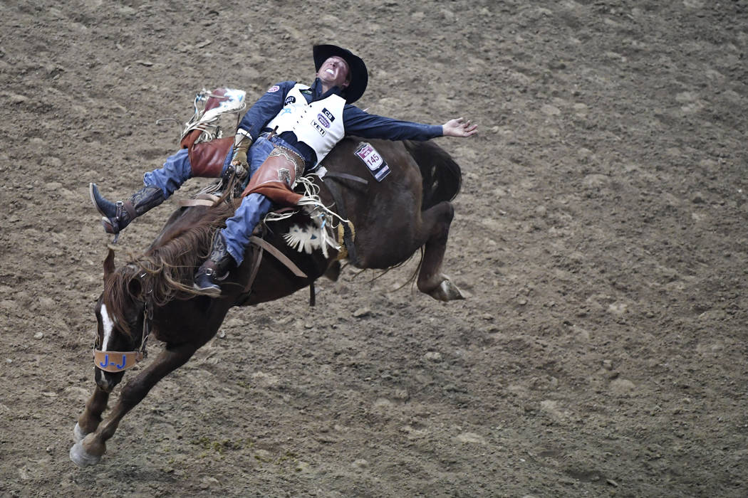 Richmond Champion from The Woodlands, Texas, competes in bareback riding during the first go-round of the National Finals Rodeo Thursday, December 7, 2017, at the Thomas & Mack Center in Las V ...
