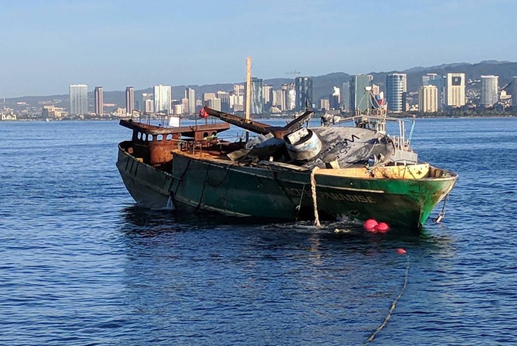 Workers sink stranded fishing boat off Hawaii reef, Nation and World