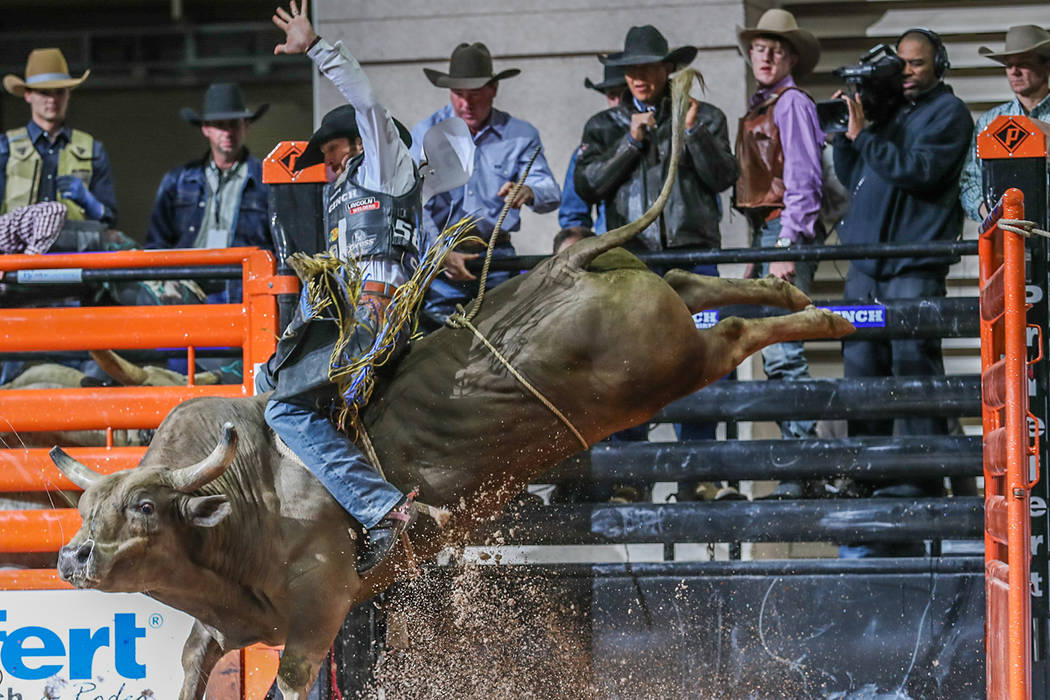 J.W. Harris rides Chocolate Thunder to a winning score of 86 points Thursday afternoon during the Cinch Boyd Gaming Chute-Out at Orleans Arena. The three-day rodeo, featuring all seven events, wra ...
