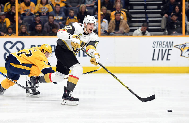 Dec 8, 2017; Nashville, TN, USA; Vegas Golden Knights defenseman Shea Theodore (27) passes the puck out of the defensive zone during the first period against the Nashville Predators at Bridgestone ...