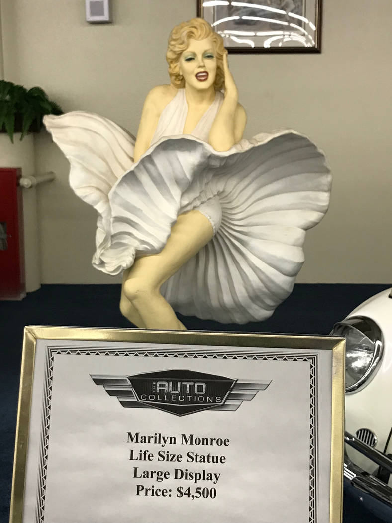 A Marilyn Monroe life-size statue on display at The Auto Collections vintage-car museum and store at The Linq hotel-casino in Las Vegas, Tuesday, Dec. 12, 2017. The vintage dealer is closing to th ...