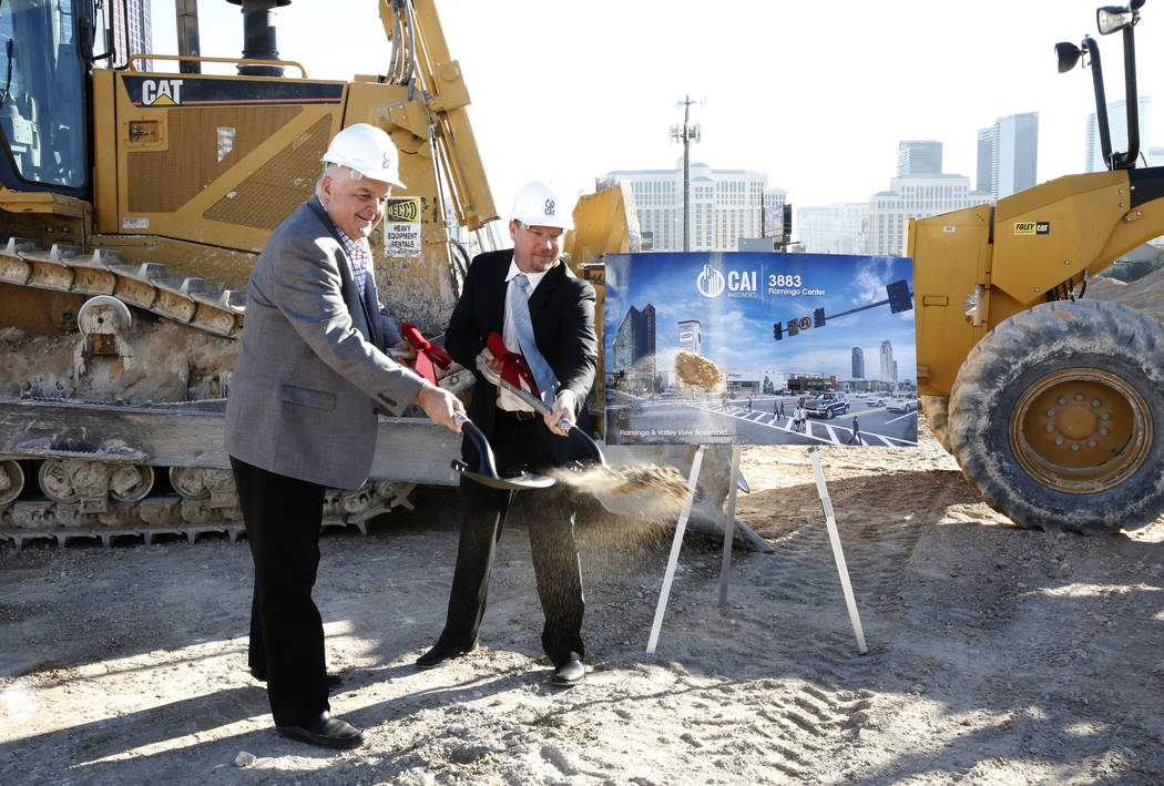 Clark County Commissioner Steve Sisolak, left, and developer Chris Beavor hold a ceremonial groundbreaking for a mixed-use project at 3883 Flamingo Road next to the Palms, Friday, Dec. 15, 2017, i ...
