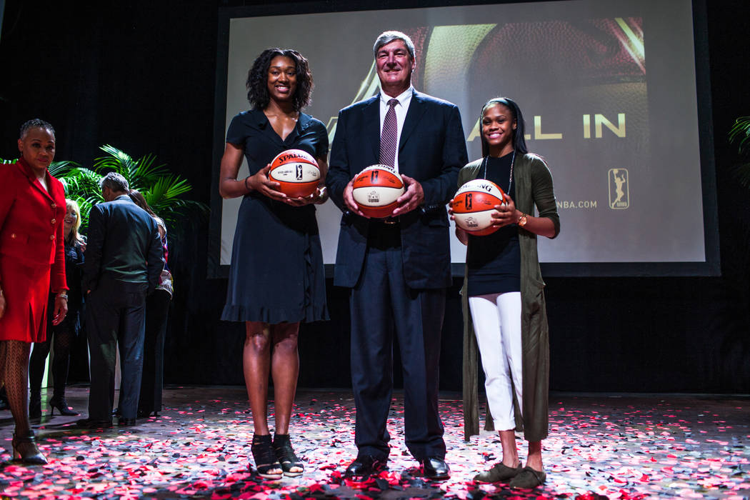 Las Vegas Aces' Kayla Janine Alexander, left, Las Vegas Aces head coach Bill Laimbeer, center, Las Vegas Aces' Moriah Jefferson, right, gather during the reveal of the Las Vegas Aces WNBA basketba ...