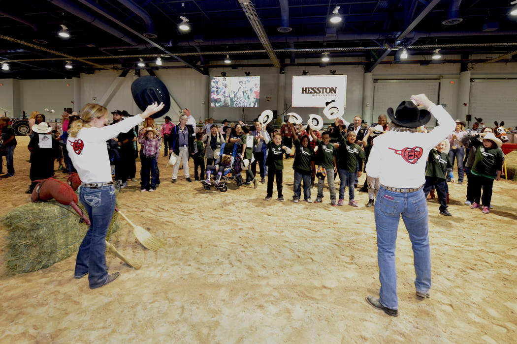 Contestants tip their hats to the audience as special needs children experience the world of rodeo with Wrangler NFR contestants, announcers, personnel and even Miss Rodeo America at The Exception ...