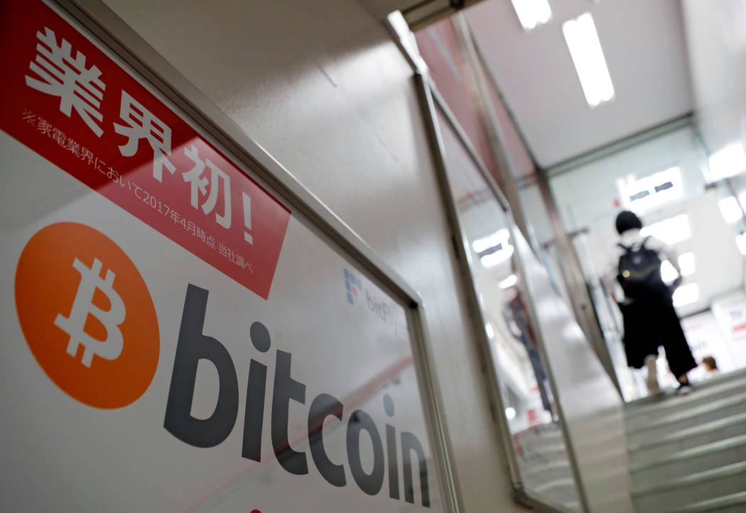A logo of Bitcoin is seen on an advertisement of an electronic shop in Tokyo, Japan September 5, 2017. (Kim Kyung-Hoon/Reuters, File)