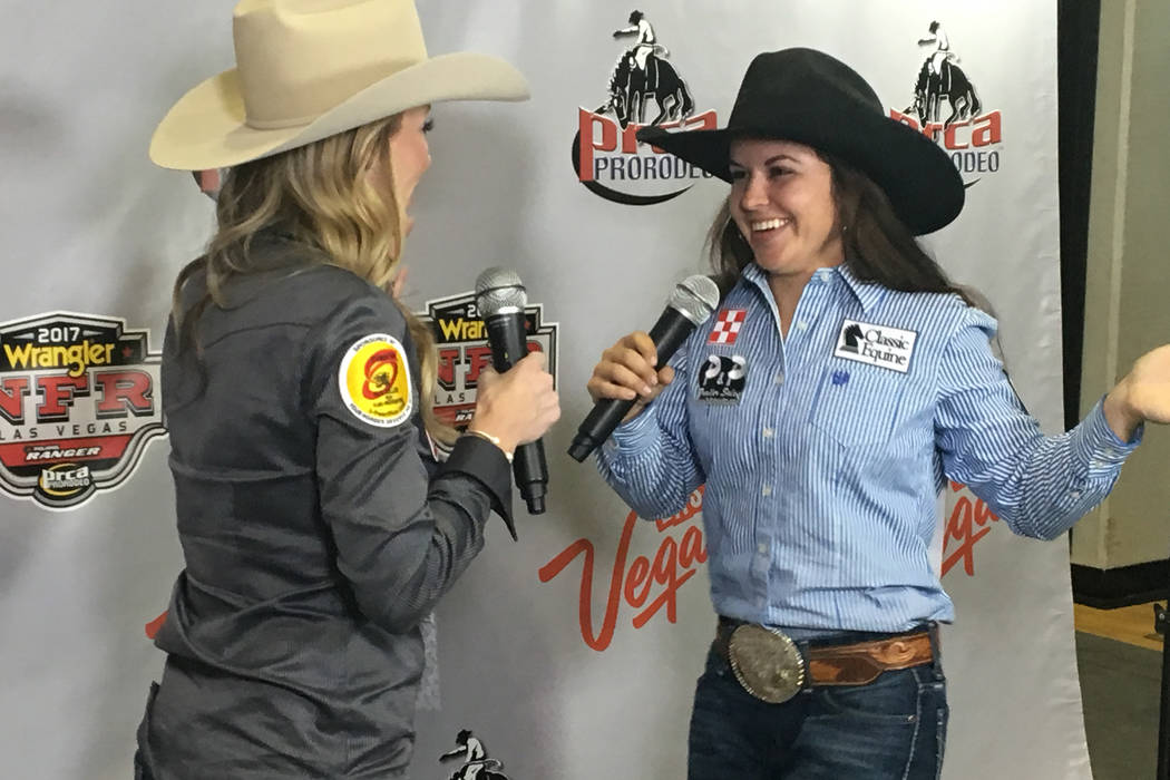 Barrel racer Hailey Kinsel does a little dance during an interview