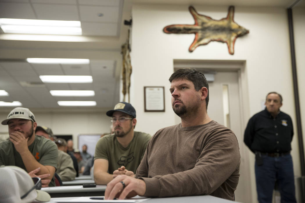 Patrick White of Reno listens during an orientation at the Clark County Shooting Complex for hunters randomly picked for the annual bighorn sheep hunt inside the Nevada Test and Training Range, in ...