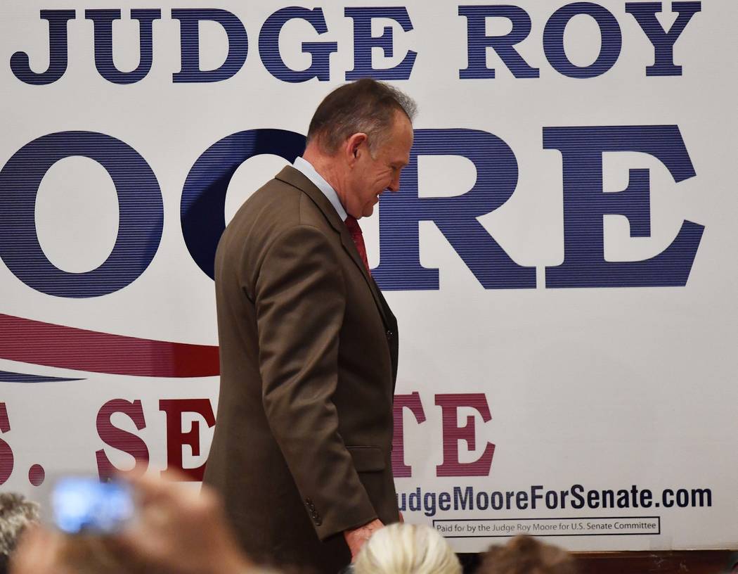U.S. Senate candidate Roy Moore leaves the stage after speaking at the RSA activity center, Tuesday, Dec. 12, 2017, in Montgomery, Ala. Moore did not concede defeat to his Democratic opponent Doug ...